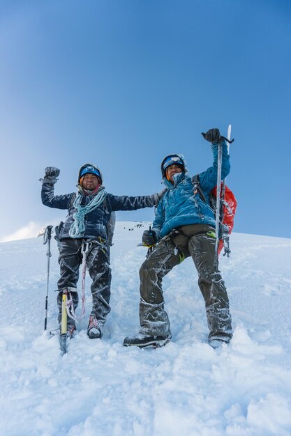 Team on the peak of mountain