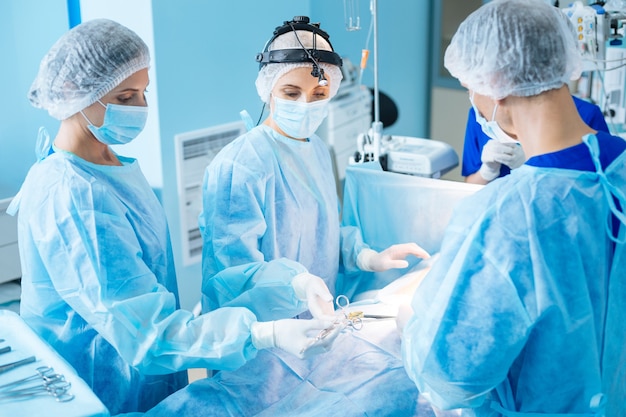 Team of professional doctors doing surgery