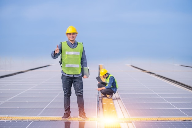 Team professional engineer working at solar power station