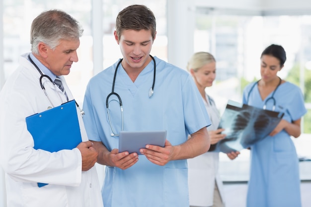 Team of smiling doctors discussing