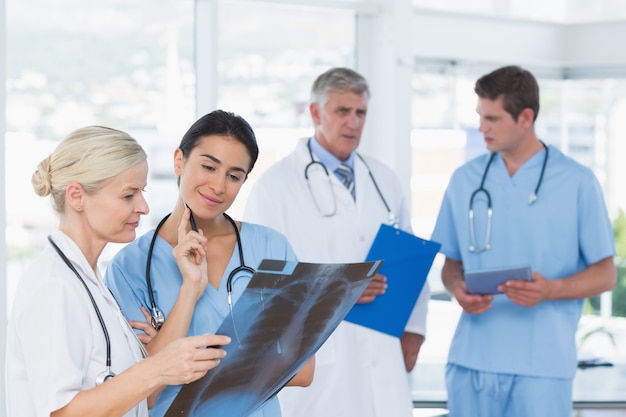 Team of smiling doctors discussing