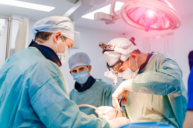 Team surgeon at work in operating room