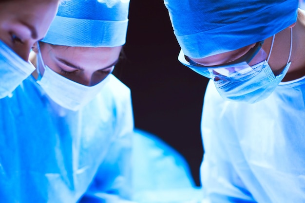 Team surgeon at work in operating room