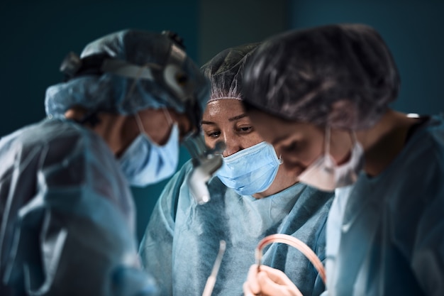 Team of surgeons doing surgery in a hospital