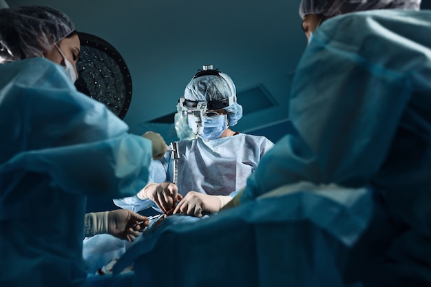 Team of surgeons doing surgery in a hospital