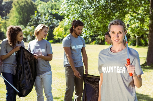 Team of volunteers picking up trash