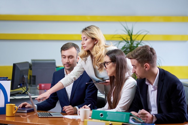 Team of women and men at meeting table