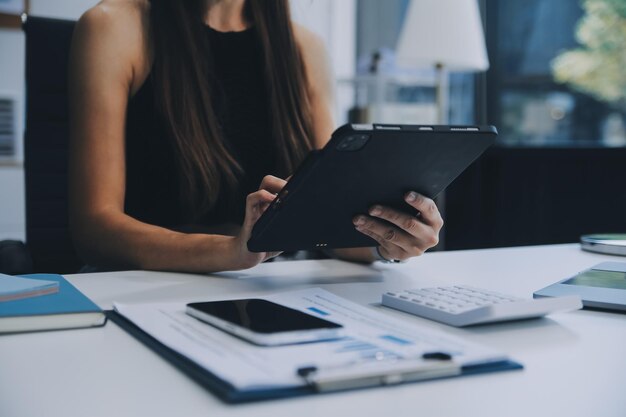 Team work process young business managers crew working with new startup project laptop on wood table typing keyboard texting message analyse graph plans