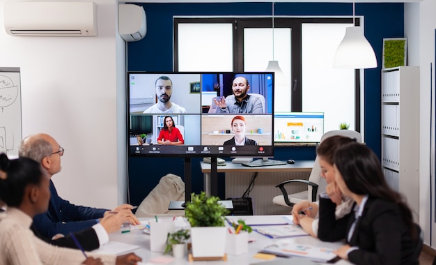 Team working by group video call share ideas brainstorming negotiating use video conference. Business people talking to webcam, do online conference participate internet brainstorming, distance office