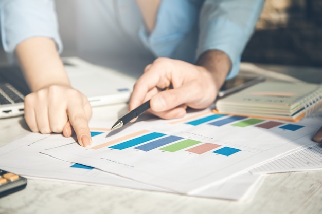 Team working in graph in office desk