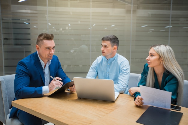 team of young professionals men and women at work in the office