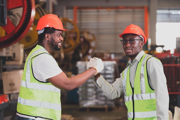 Teamwork African American worker in the factoryBlack man afro work heavy industrial