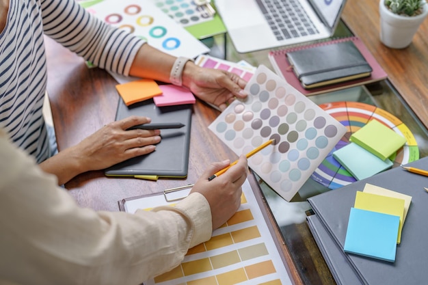 Teamwork brainstorming Creative idea Business project Business People meeting taking notes while discussing with Color swatch samples to share idea