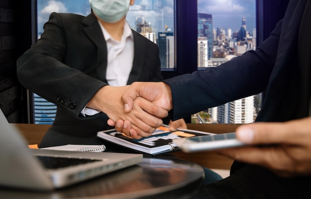 Teamwork business concept of group of three coworkers join hand together during their meeting