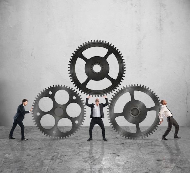 teamwork of businesspeople work together to a system of gears