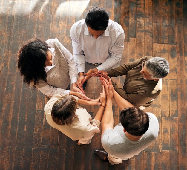 Photo teamwork circle and synergy of people hands for collaboration workflow and group or team building above integration formation and support cooperation or community of women and men with agreement