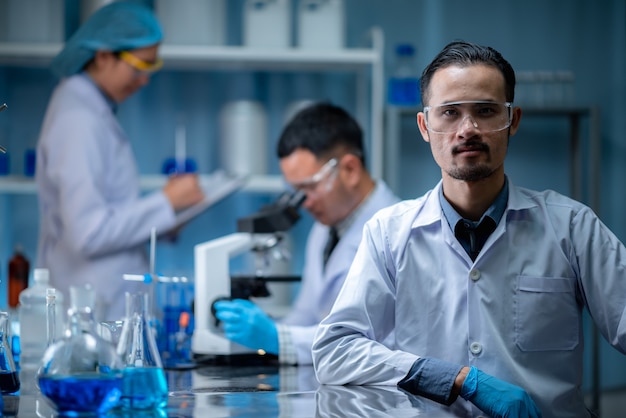 The teamwork specialist scientis or reseacher test and develope the drug chemical vaccine experiment through the microscopic  at the modern biological laboratory