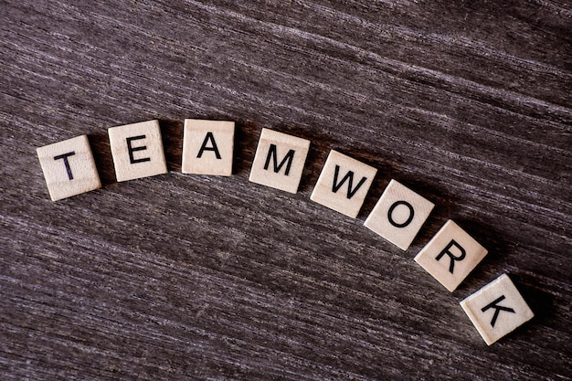 Teamwork text on wooden table