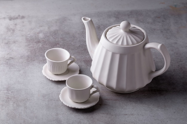 Teapot creamer, Cup and saucer on Cement Board