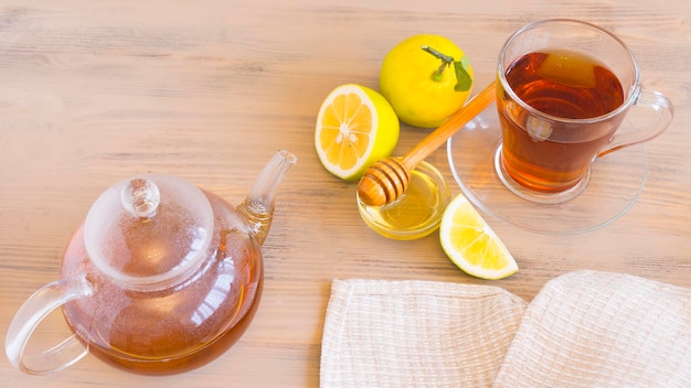 Teapot and cup of tea on the table