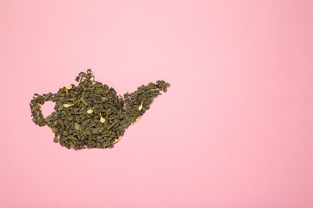 Teapot shape made of dry jasmine green tea leaves.