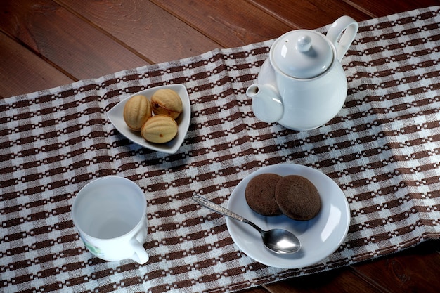 Teapot with a cup