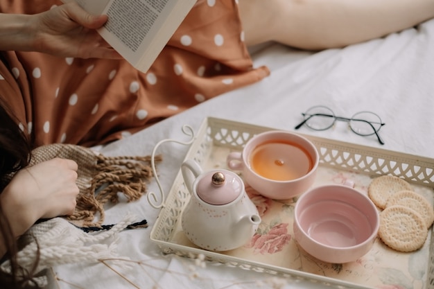 Teapot with tea and cups on a tray