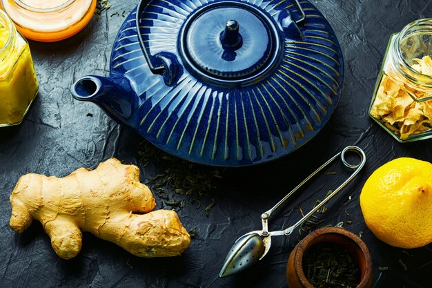 Teapot with tea made from ginger,honey and lemon.Vitamin, healing tea