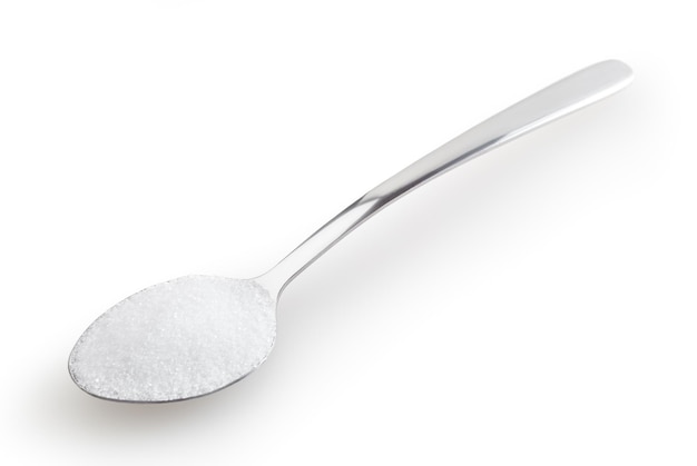 Teaspoon of salt isolated on white background with clipping path