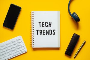 tech trends top new technology trends word trends on open notepad with different gadgets and devices
