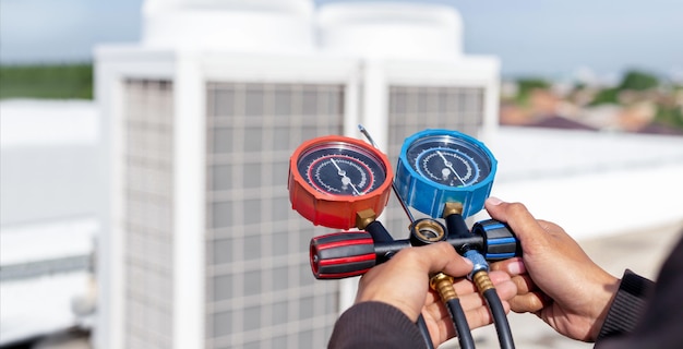 Photo technician check air conditioner operation