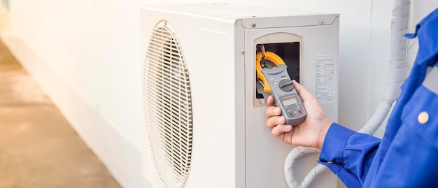 Technician checking the operation of the air conditioner