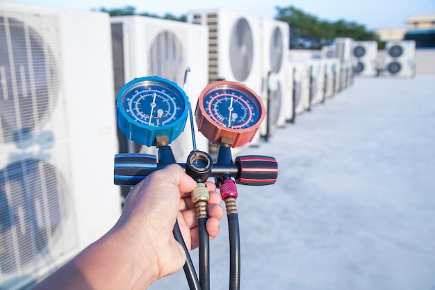 Technician checking the operation of the air conditioner