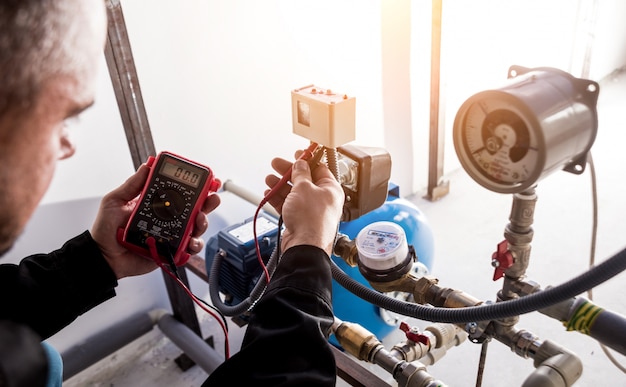 Technician checking water system nodes.