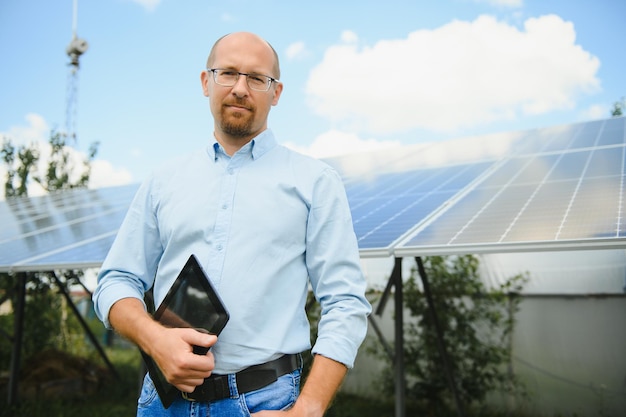 Technician checks the maintenance of the solar panels