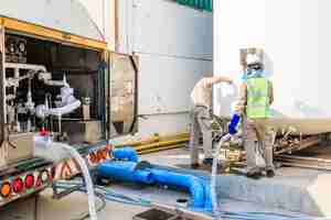 Photo technician fill with liquid nitrogen with nitrogen storage tank at new factory