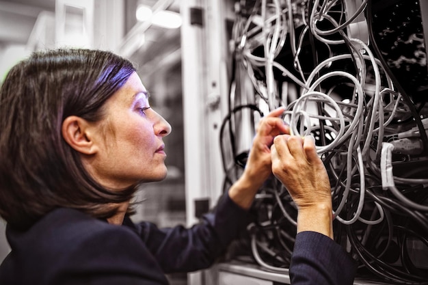 Technician fixing cable