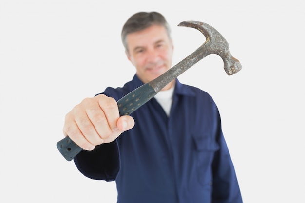 Photo technician holding hammer