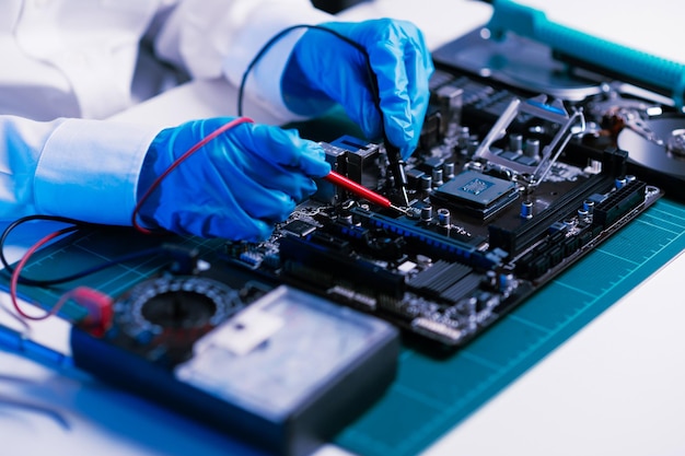 The technician is putting the CPU on the socket of the computer motherboard electronic engineering electronic repair electronics measuring and testing repairxAxA