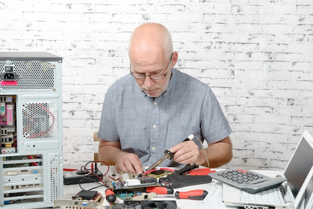 Technician repairing computer hardware 