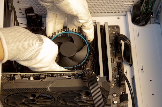 Technician repairing computer installing CPU