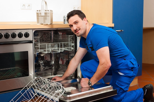 Photo technician repairing the dishwasher