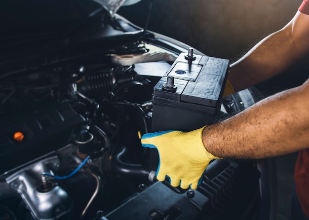 Technician replaced new battery of the car