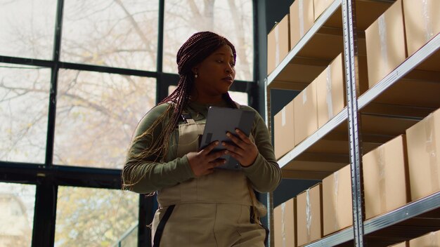 Photo technician reviews warehouse inventory