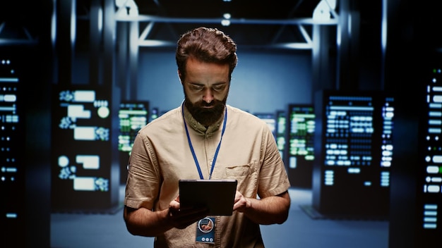 Technician in server routine maintenance