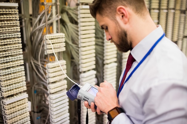 Technician using digital cable analyzer