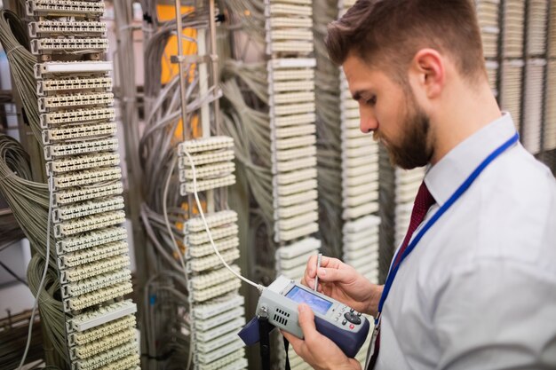 Technician using digital cable analyzer