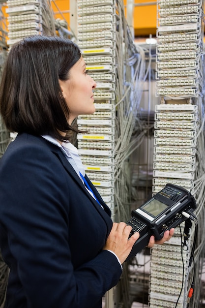 Technician using digital cable analyzer