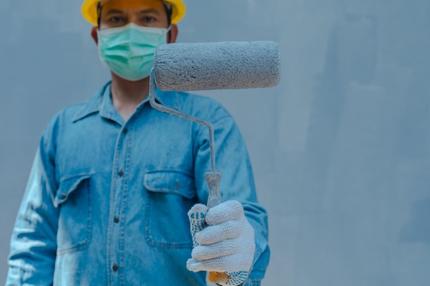 Photo technician using paint roller