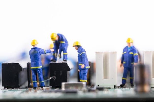 Technician workers repair and discussing connection maintanance with miniature human